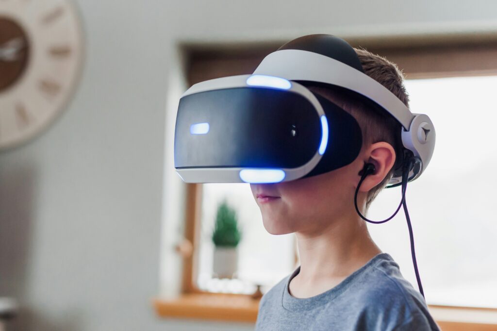 boy wearing black and white vr headset at an event in Spain