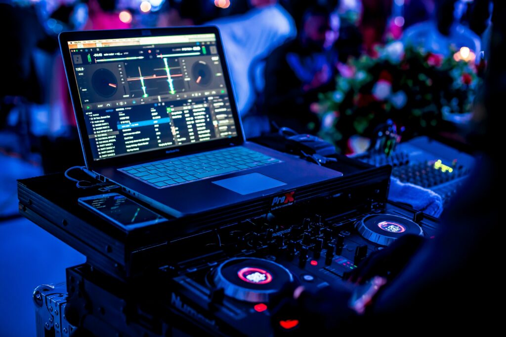 a dj using a notebook during a party